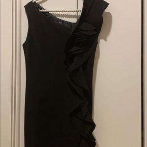 Black cocktail dress with ruffled fabric on side